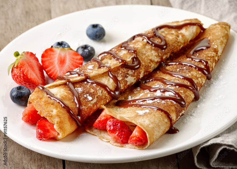 Crepes with strawberries and chocolate Crepes with strawberries and chocolate