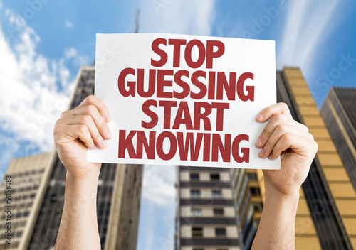 Wallpaper Mural Stop Guessing Start Knowing placard with cityscape background Torontodigital.ca