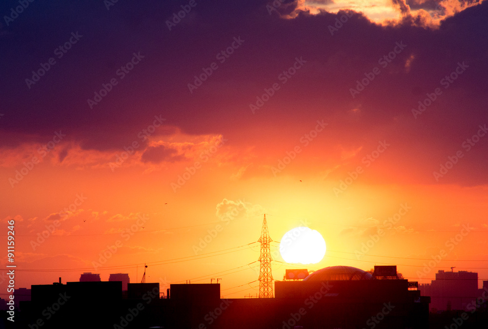 Sunset over gurgaon cityscape with monsoon clouds Sunset over gurgaon cityscape with monsoon clouds