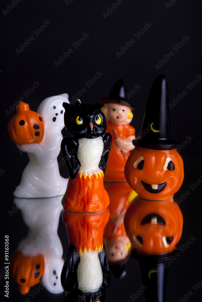 Halloween figures grouped shot front on close-up and portrait on a black background with reflection Halloween figures grouped shot front on close-up and portrait on a black background with reflection