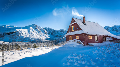 Fototapeta Naklejka Na Ścianę i Meble -  Warm accommodation in a mountain cottage in winter