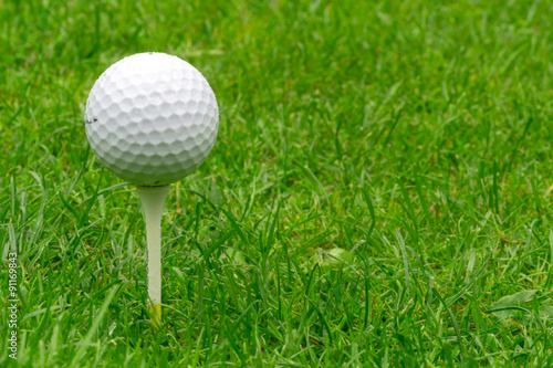 Single Golf Ball Balancing on a Tee