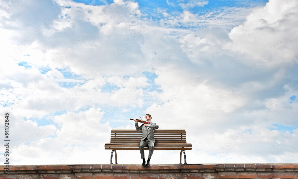 Businessman play violin