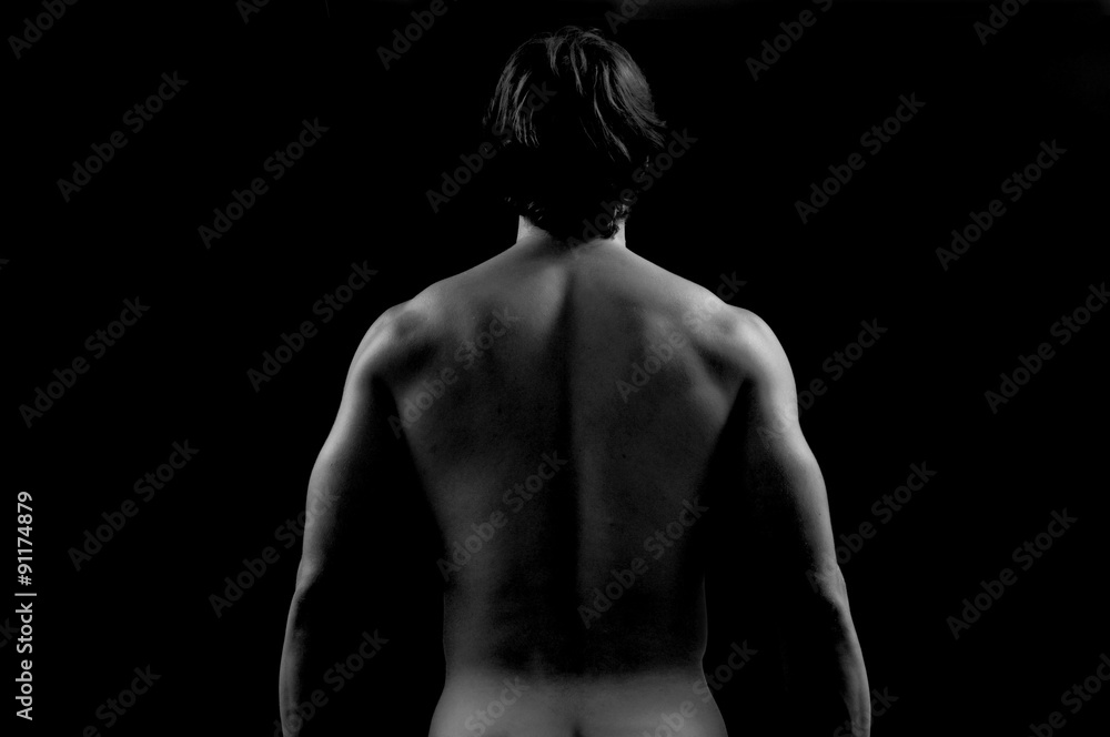 Studio photography of a man with His back, white and black Studio photography of a man with His back, white and black