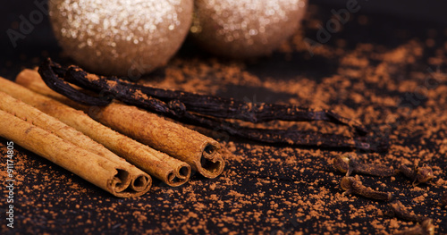 cinnamon sticks, vanilla, sprinkled with cocoa