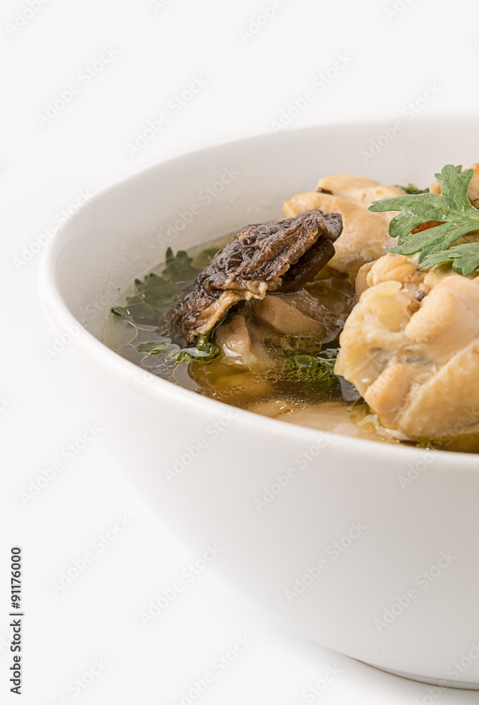 Traditional chicken broth on white background Traditional chicken broth on white background