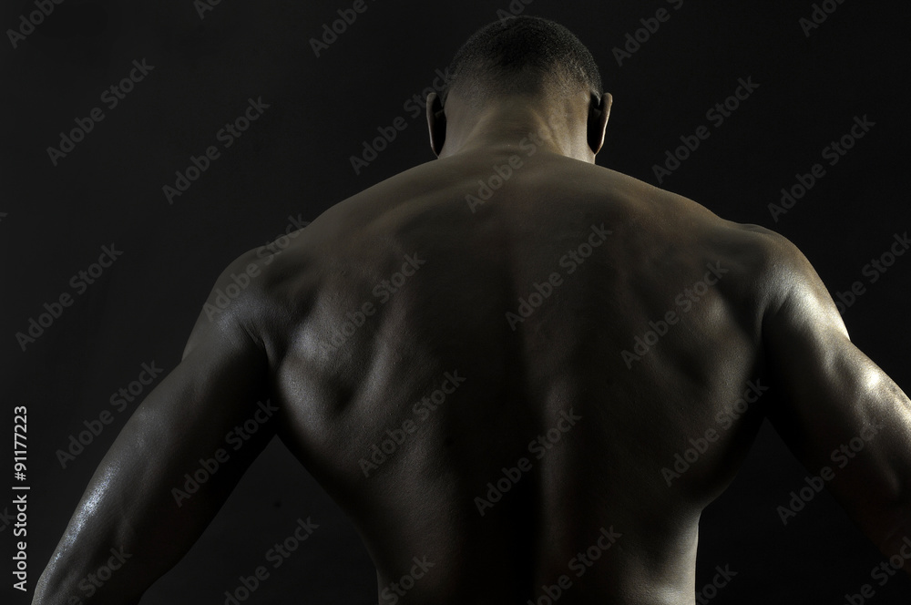 back of a naked African boy back of a naked African boy