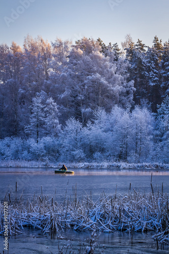 Man on small boat swim on f...