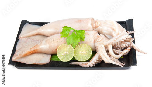 fresh squid with lemon and parsley isolated on white