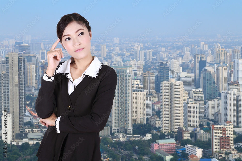 Business woman thinking with city Business woman thinking with city