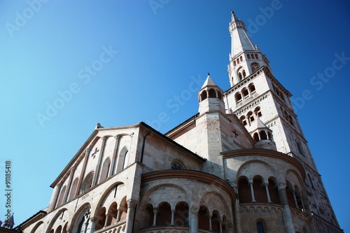 White Cathedral under blue sky in Modena, Italy  photo