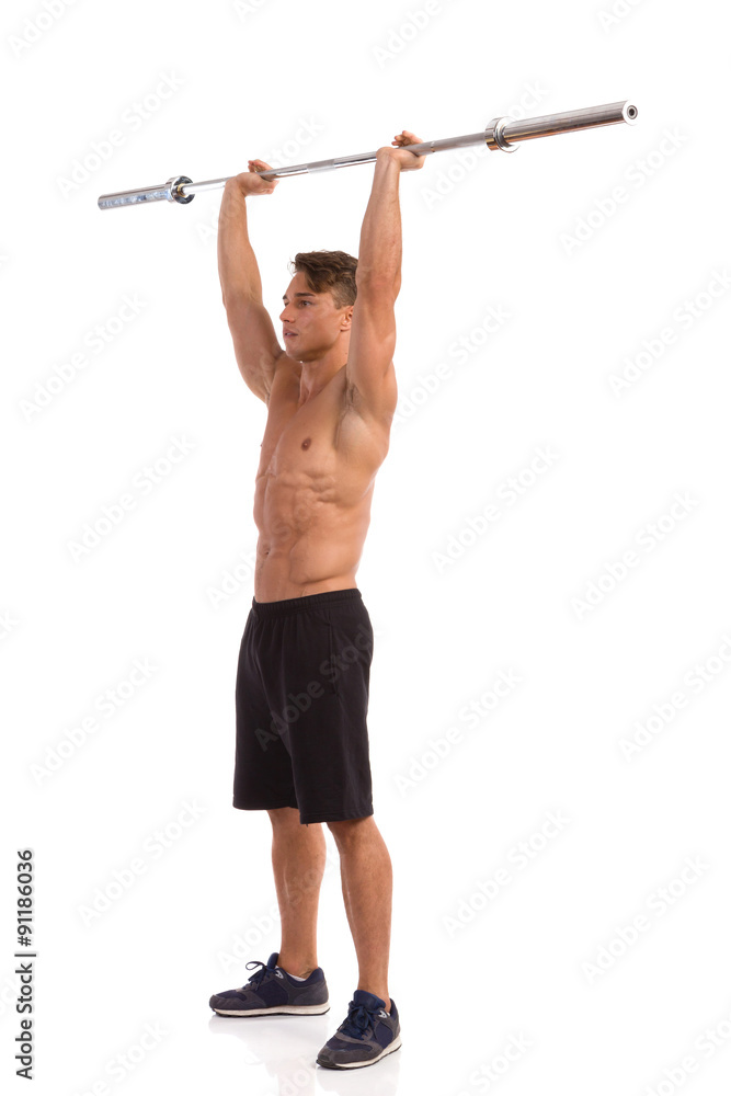 Strong Man Holding Barbell Over His Head