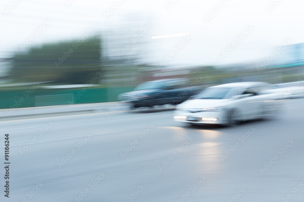 Fototapeta premium car driving on road with traffic jam in the city, abstract blurred