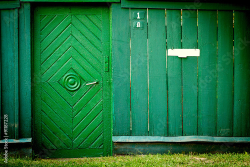 The old vintage wooden doors and fence
