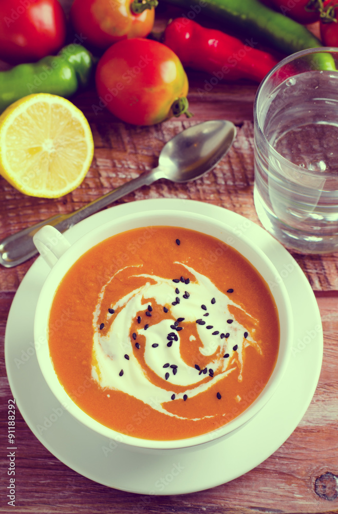 Pumpkin Soup with tomatoes, chili, yogurt and black sesame seeds Pumpkin Soup with tomatoes, chili, yogurt and black sesame seeds