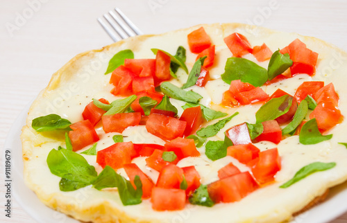Omelet with tomato and cheese