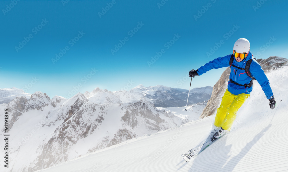 Man skier running downhill