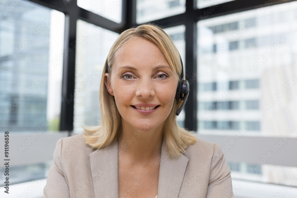 Smiling Businesswoman in the office on video conference, headset Smiling Businesswoman in the office on video conference, headset