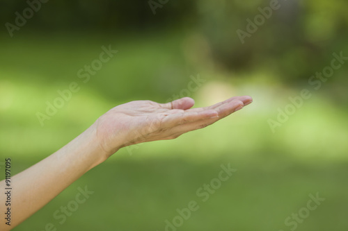 empty human hand with bokeh background © tatomm