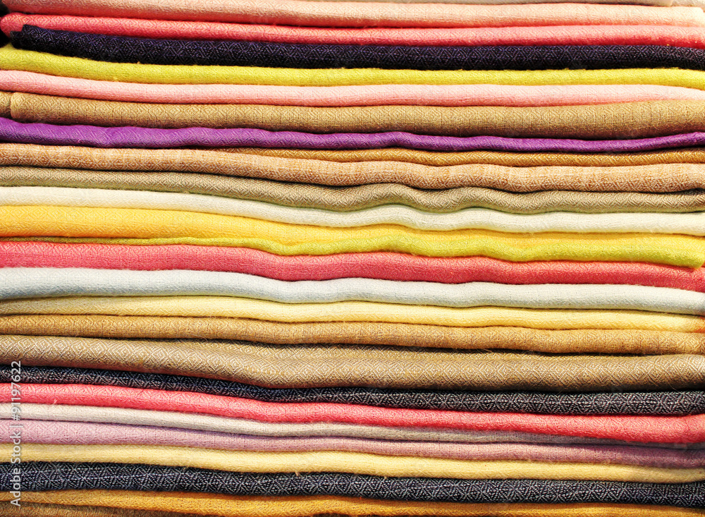 Folded scarfs and fabrics background Folded scarfs and fabrics background