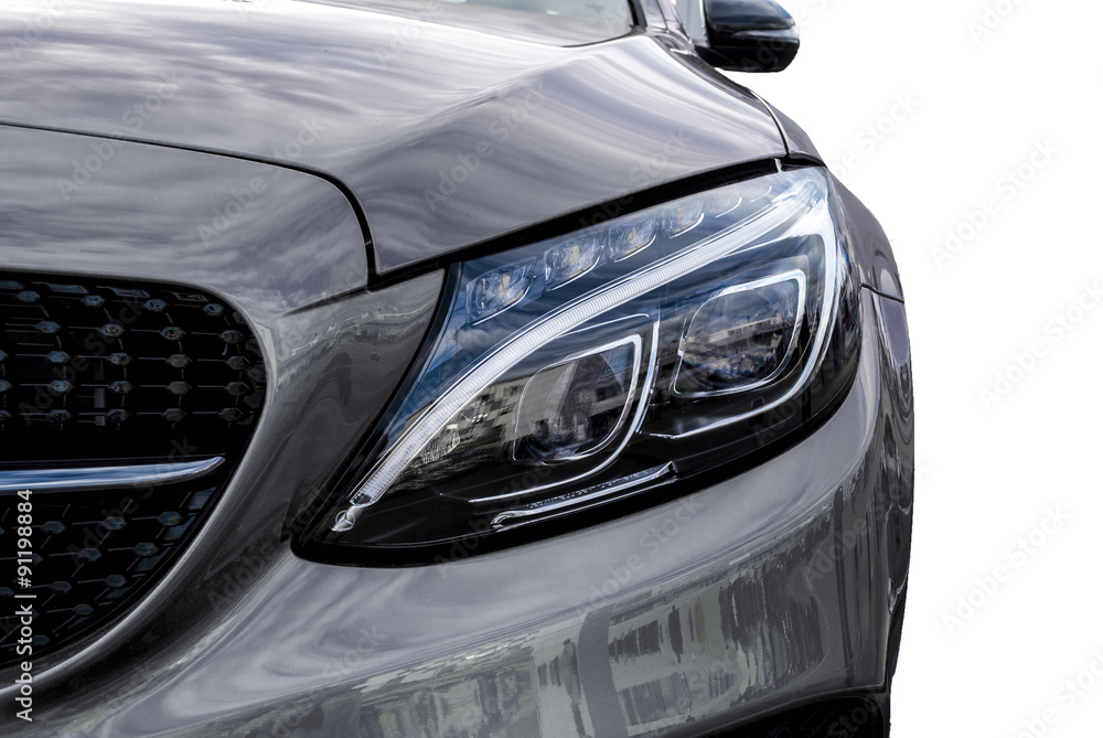 Closeup headlights of ca and Car exterior detail with White back Closeup headlights of ca and Car exterior detail with White back