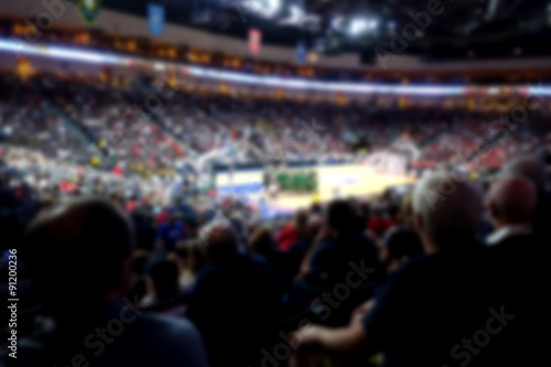 blurred basketball crowd watching game in arena