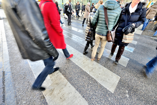 Winter zebra crossing with pedestrians