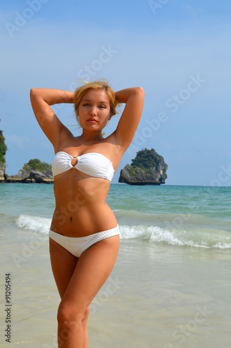 Sexy girl posing on beach