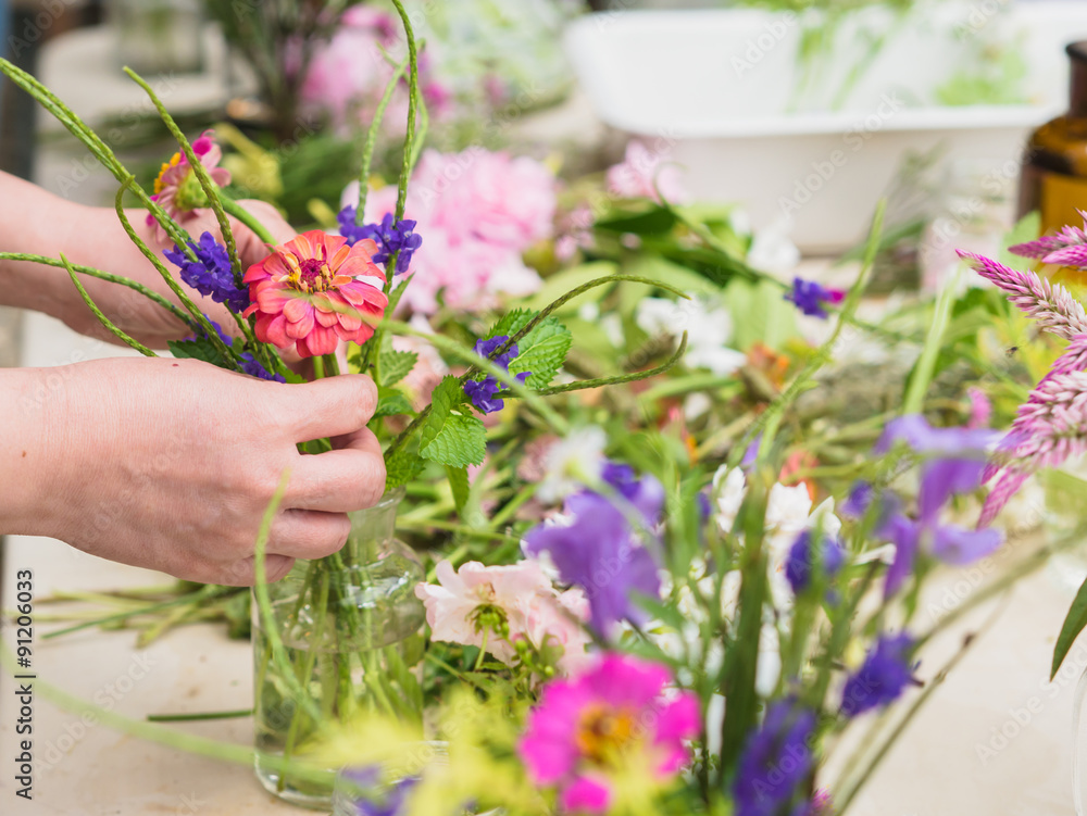 custom made wallpaper toronto digitalHands of old woman arranging flowers.