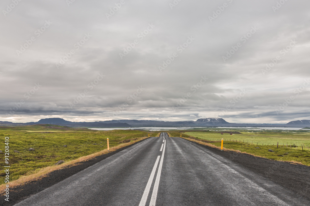 Isolated road and mountain landscape at Iceland, summer time