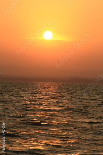 Fototapeta Naklejka Na Ścianę i Meble -  Sun reflection at sunset sunrise over the water