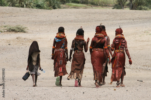 A group of Turkana women walk home after rehersals for the  Turkana Festival performance photo