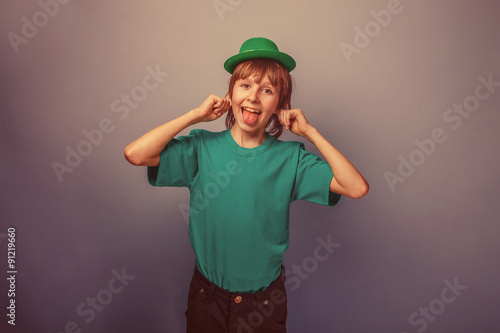 European-looking boy of ten years smiley shows the language in a