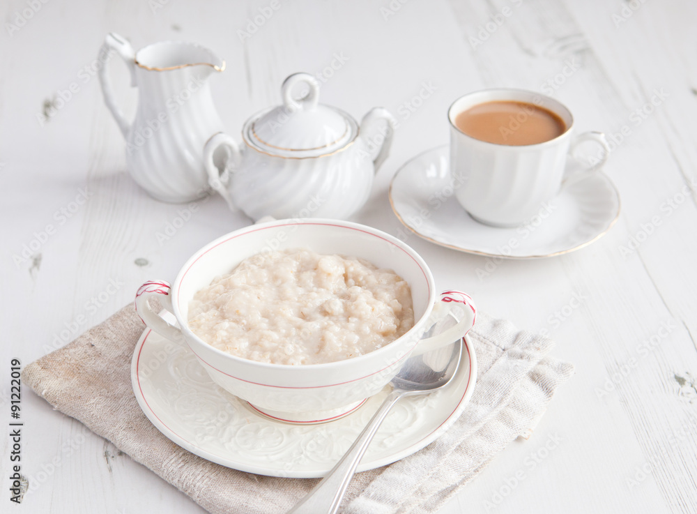 healthy breakfast: oats porridge with coffee on the table healthy breakfast: oats porridge with coffee on the table