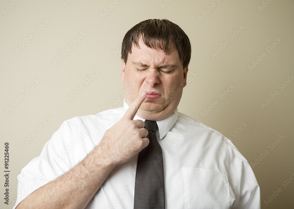 Man with his finger by his nose Man with his finger by his nose