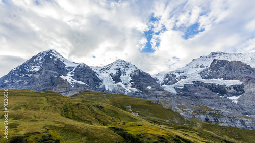 View of Eiger, Monch and Jungfrau massif from Kleine Scheidegg railway station on Swiss Alps, Switzerland, Europe