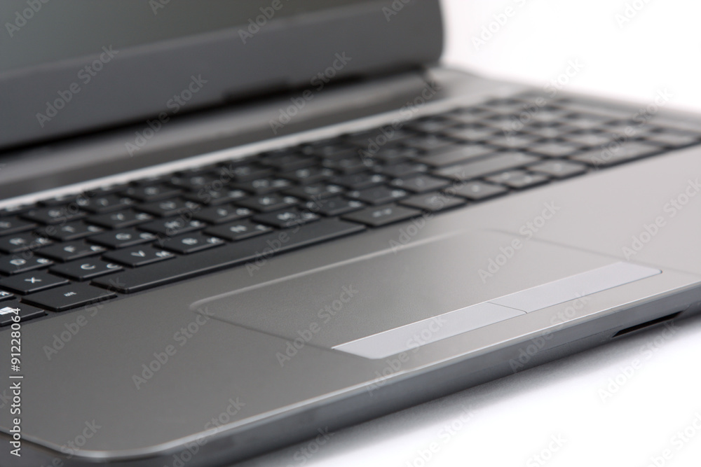 close-up touchpad and keyboard of the notebook on white close-up touchpad and keyboard of the notebook on white