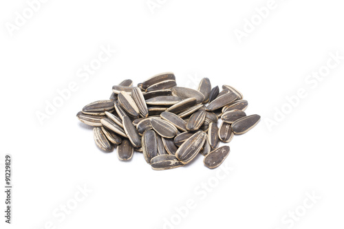 Sunflower seeds on white background.