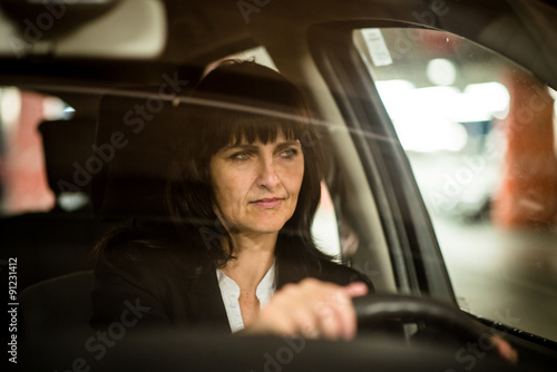 Senior business woman driving car © Martinan