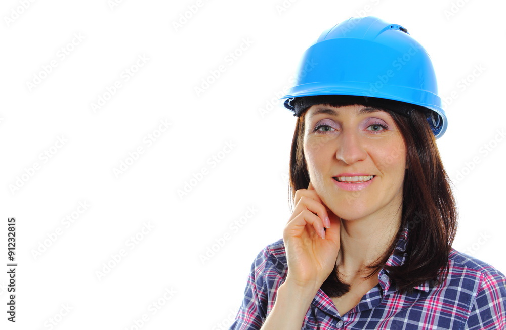 Smiling builder woman wearing protective blue helmet Smiling builder woman wearing protective blue helmet