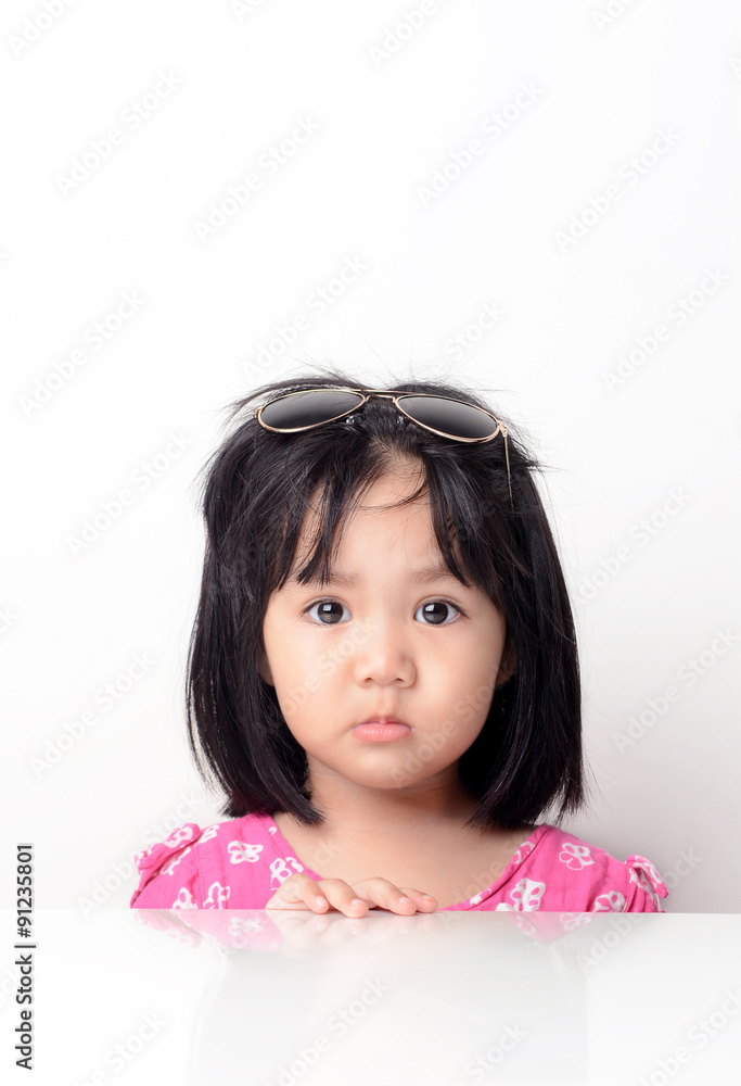 Little girl portrait seating at the table Little girl portrait seating at the table