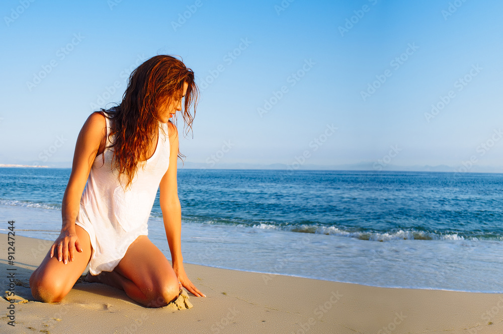 Beauty Young Woman Enjoying the Beach at Sunset