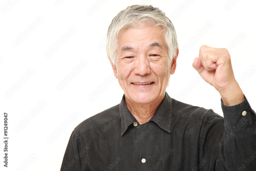 senior Japanese man in a victory pose senior Japanese man in a victory pose
