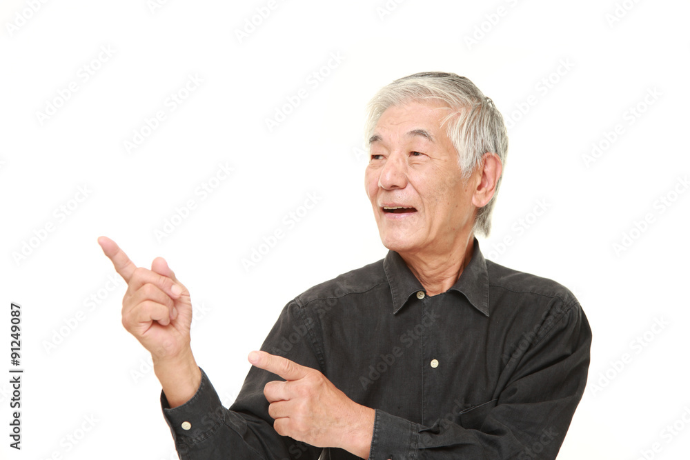 senior Japanese man presenting and showing something senior Japanese man presenting and showing something