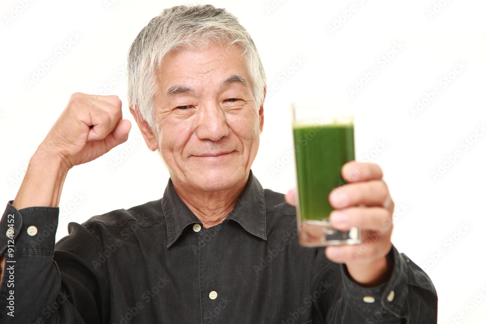 senior Japanese man with green vegetable juice senior Japanese man with green vegetable juice