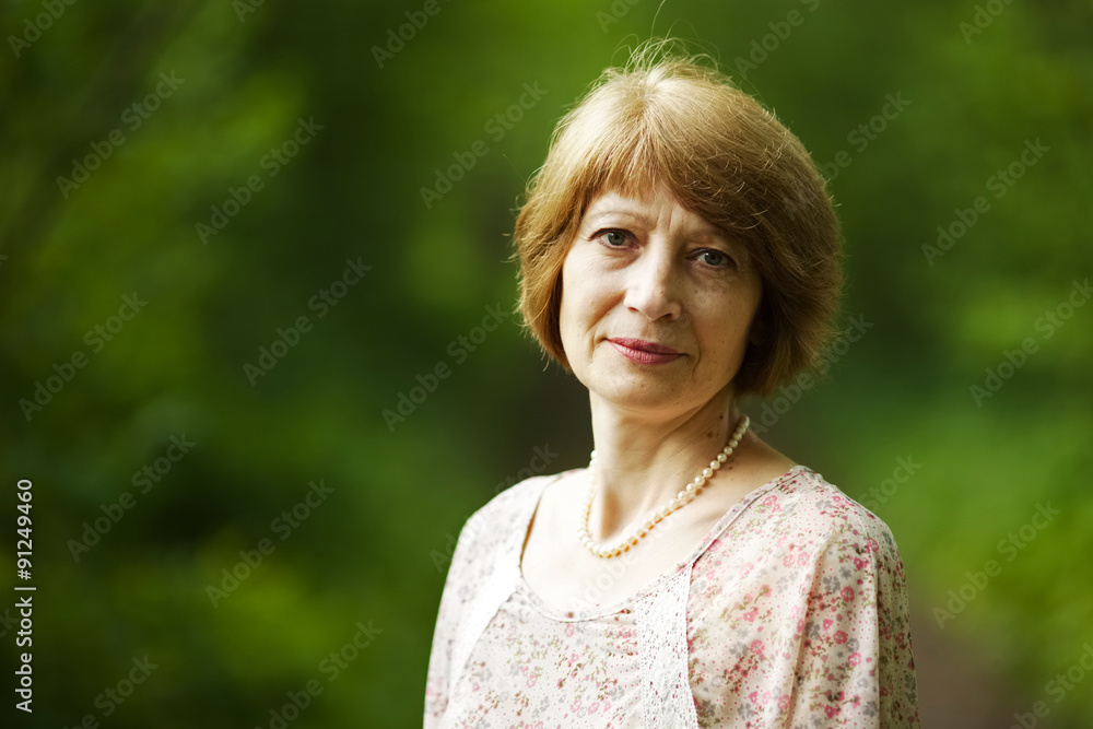 Beautiful elderly woman with pearl beads Beautiful elderly woman with pearl beads