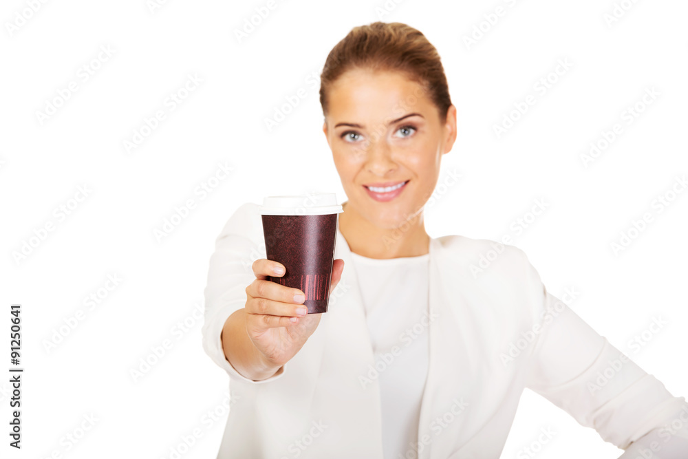 Businesswoman drinking coffee from paper cup Businesswoman drinking coffee from paper cup