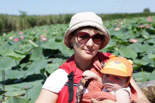 Woman with baby on the Plantation Indian lotus photo