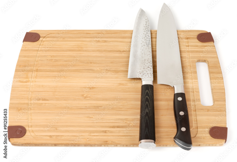 Two knives on a cutting board