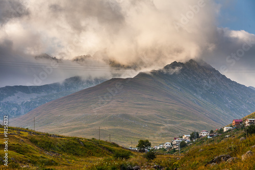 Mountain houses with clouds in Ayder Plateau, Rize, Turkey